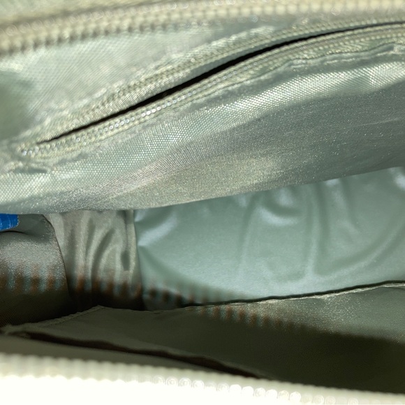 Green insulated small Disney Mickey Mouse tote purse over shoulder. - Picture 2 of 4